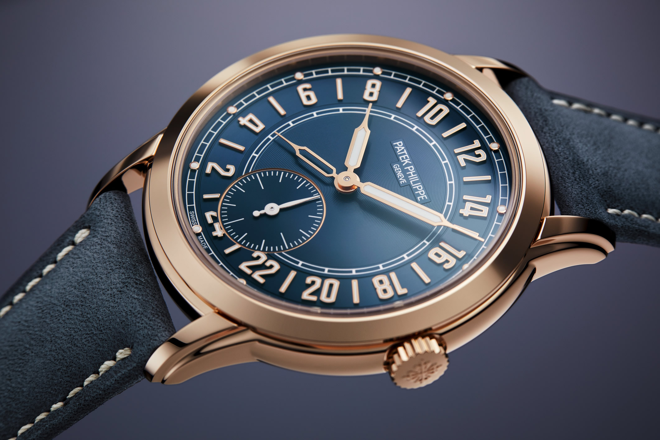 Calatrava Travel Time watch by Patek Philippe with dual time zone, rose gold case and a blue dial